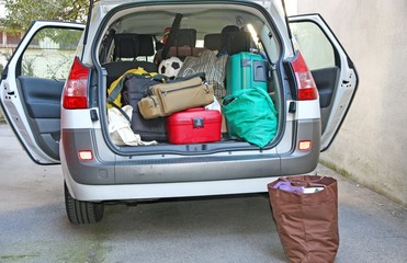 car full of luggage before departure