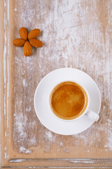 espresso coffee and almonds on old rustic table