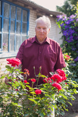 old men with rose in garden