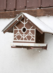 Bird box under snow during the winter