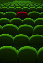 green cinema or theater empty seats with red one