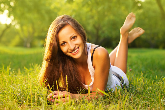 Pretty smiling girl relaxing outdoor