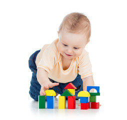 little child playing with building blocks