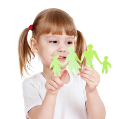 Little girl holding and showing on family cutting from paper