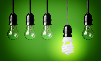 Idea concept with light bulbs and energy save bulb.