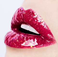 Beautiful glossy female lips close up
