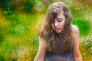 Shy teenage girl alone outside in nature