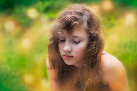 Shy Teenage Girl Alone Outside In Nature