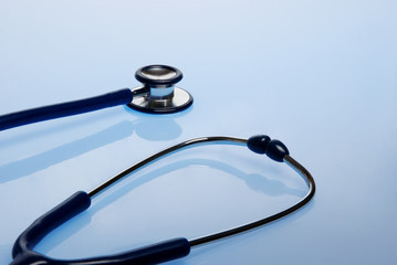 Stethoscope on blue background