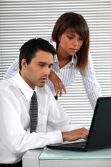Fototapeta premium co-workers in front of laptop