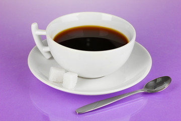 A cup of strong coffee on purple background