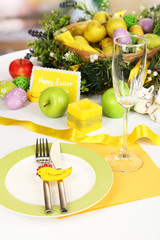Serving Easter table on room background