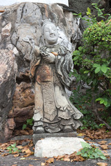 Fototapeta na wymiar Chińskiego boga STONE Rze¼by w Tajlandii świątyni