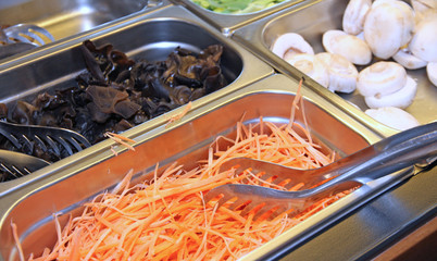 very fine cut carrots and mushrooms for sale at Asian self-servi