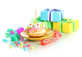 Colorful birthday cake with candle and gifts isolated on white