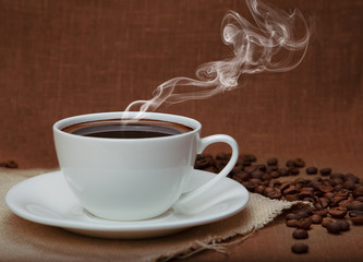 steaming coffee on flax background