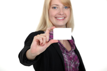 young businesswoman holding a visit card