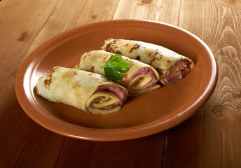 rolled pancakes stuffed ham and cheese.