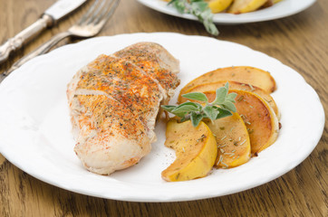 Baked chicken and saute quince with rosemary horizontal