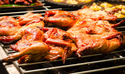 Red curry grilled chicken on the grill