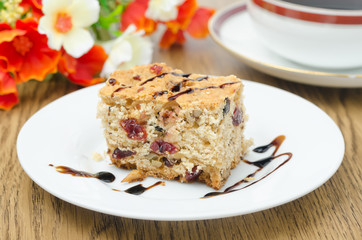 piece of cake with dried cranberries and walnuts horizontal