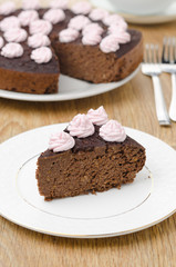 piece of chocolate cake with nuts on a plate