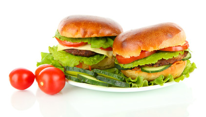 Big and tasty hamburgers on plate isolated on white