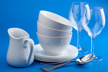white tableware over blue background
