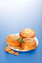 Three cinnamon rolls on plate