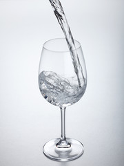 Water flowing into glass