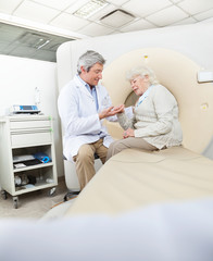 Radiologist Comforting Female Patient