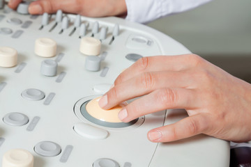 Female Radiologist Operating Ultrasound Machine