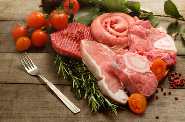 raw meat selection with pink pepper and herbs