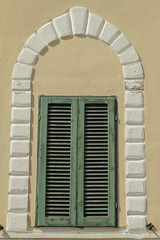 vintage shuttered window with decorative  arc