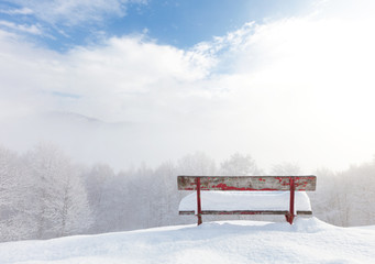 bench in front of winter landscape