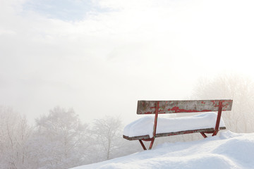 bench in front of winter landscape