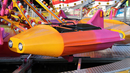 A Seat Carriage on a Fast Fun Fair Ride.
