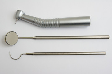 Dental instruments. Mirror, probe and handpiece (drill) with bur