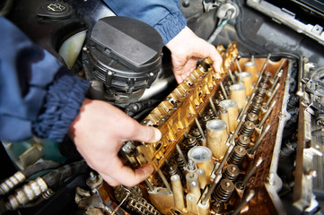 machanic repairman at automobile car engine repair