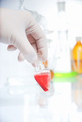 Doctor's hand in glove with blood