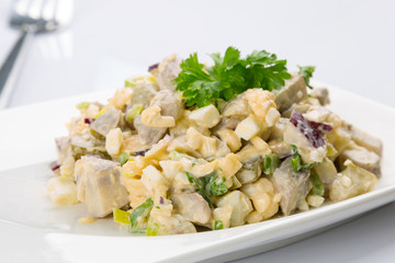 Eggs and mushrooms salad with leek and red onion on the plate