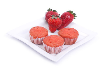 strawberry and  muffins on a square plate isolated on white