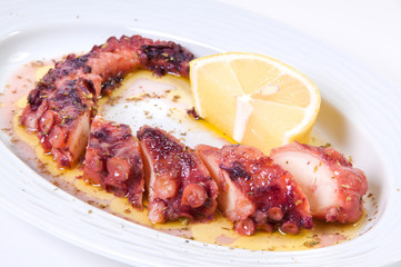 Grilled octopus with lemon sauce.