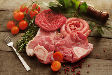 raw meat selection over rough wood