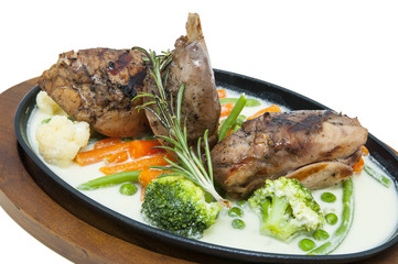 roasted rabbit meat and potatoes with vegetables