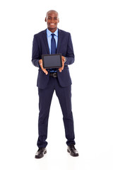 happy african american businessman holding tablet computer