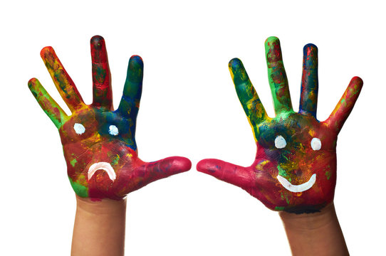 child hands painted with watercolors