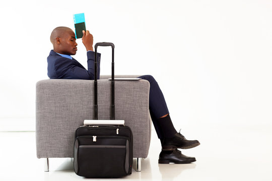 Tired African American Businessman Resting In Airport VIP Lounge