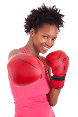 Portrait of a fitness woman wearing boxing gloves