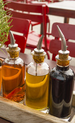 balsamic vinegar bottles and condiments on the table in an open